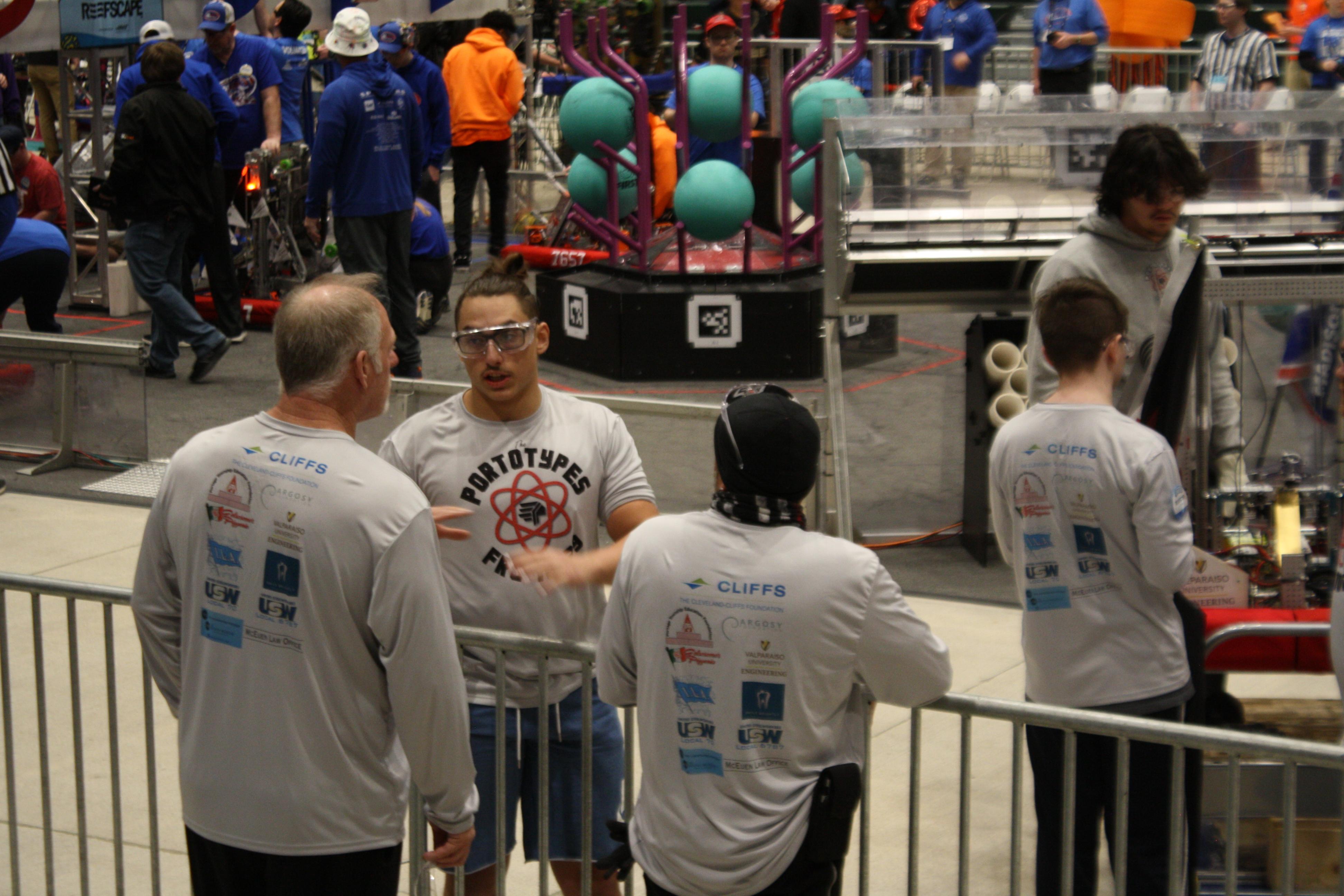 Team member talking to coachs after a match