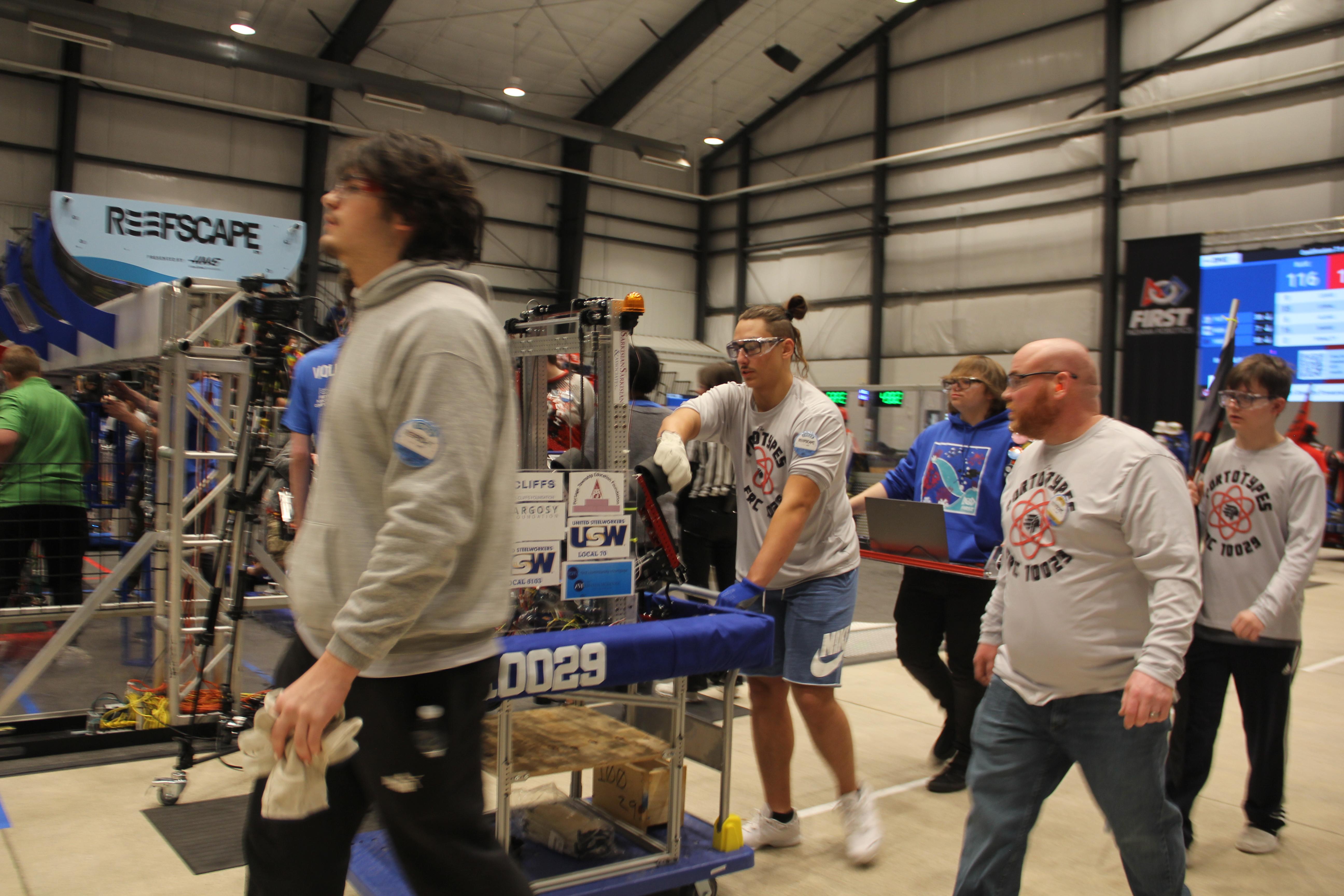 Team members walking to pits after match