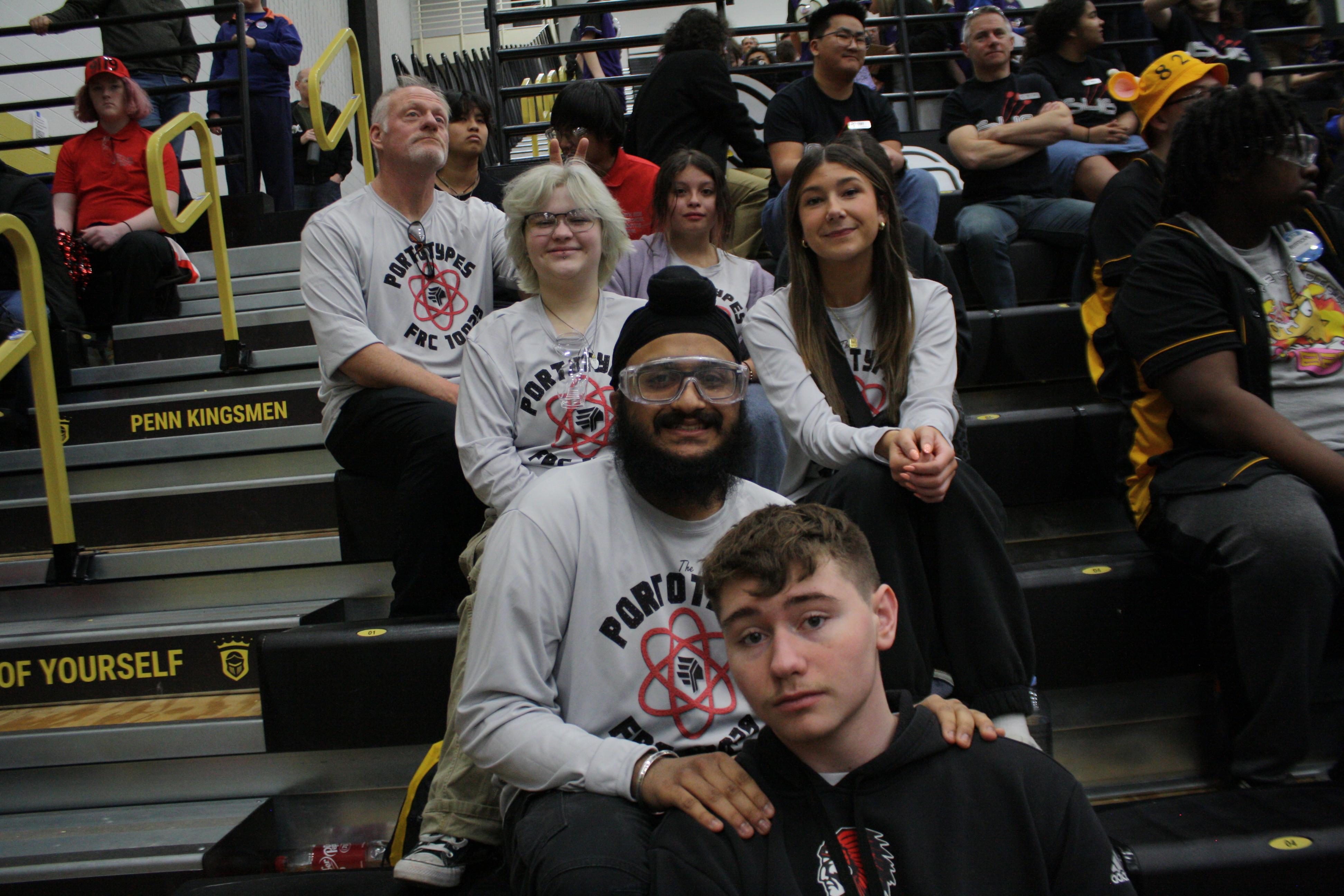 A few of the team members sitting in the stands